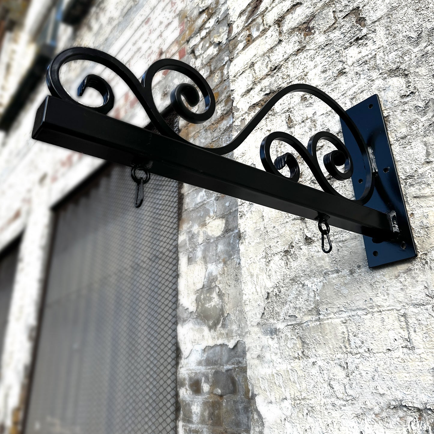 Ornate hanging bracket with scrolls