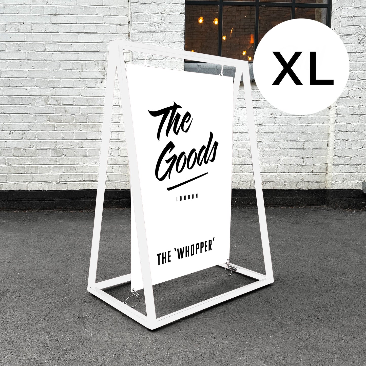 Giant swinging pavement sign